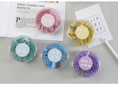 office supply binder clips in different colors