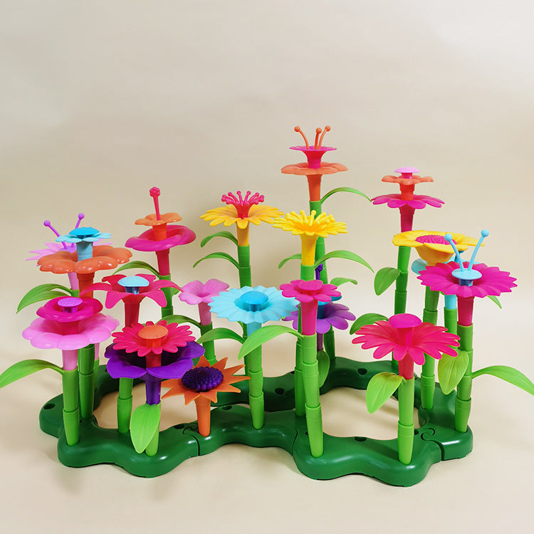 child playing with colorful garden building blocks