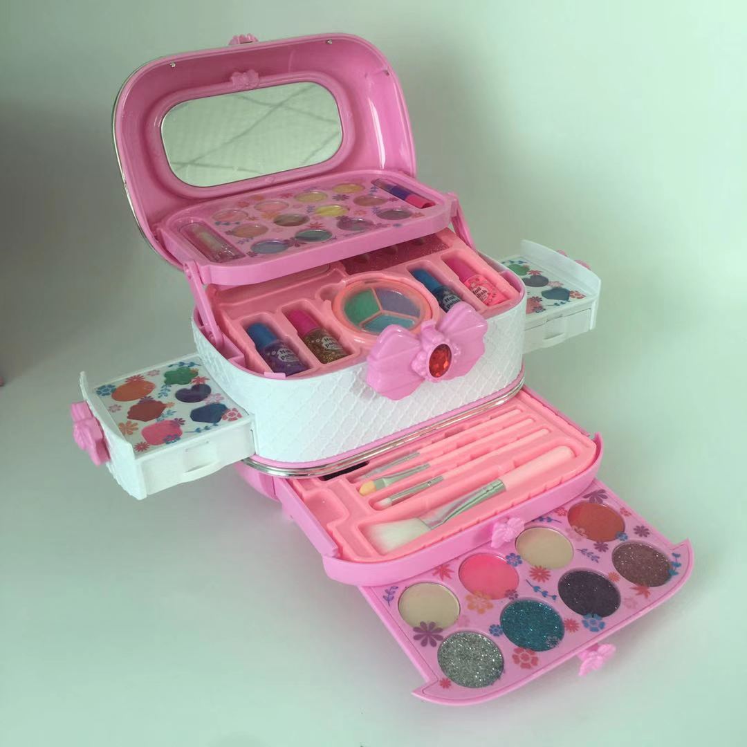 child with open makeup kit showing colorful cosmetics