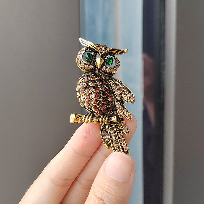 Vibrant blue owl brooch displayed on a table image 8
