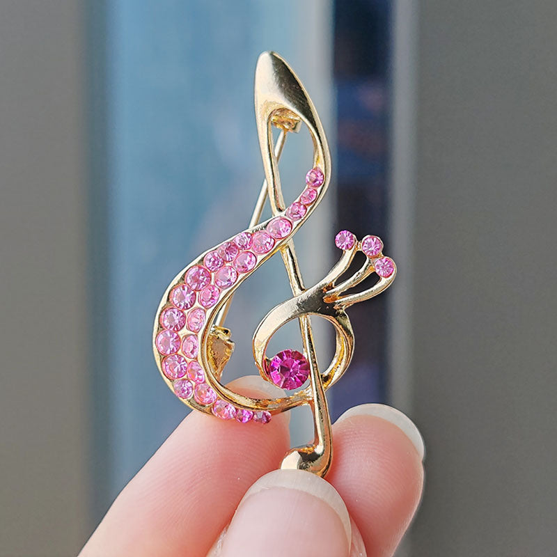 Heart-shaped musical note brooch design