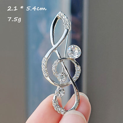 Heart-shaped musical note brooch design