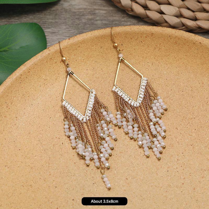 Artistic handmade earrings on display image 10