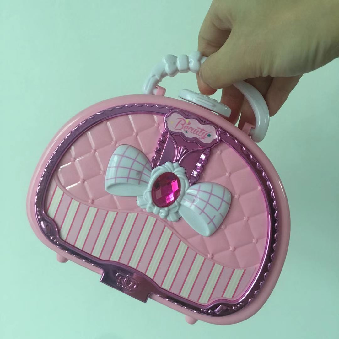 girl's pink cosmetic case with makeup products