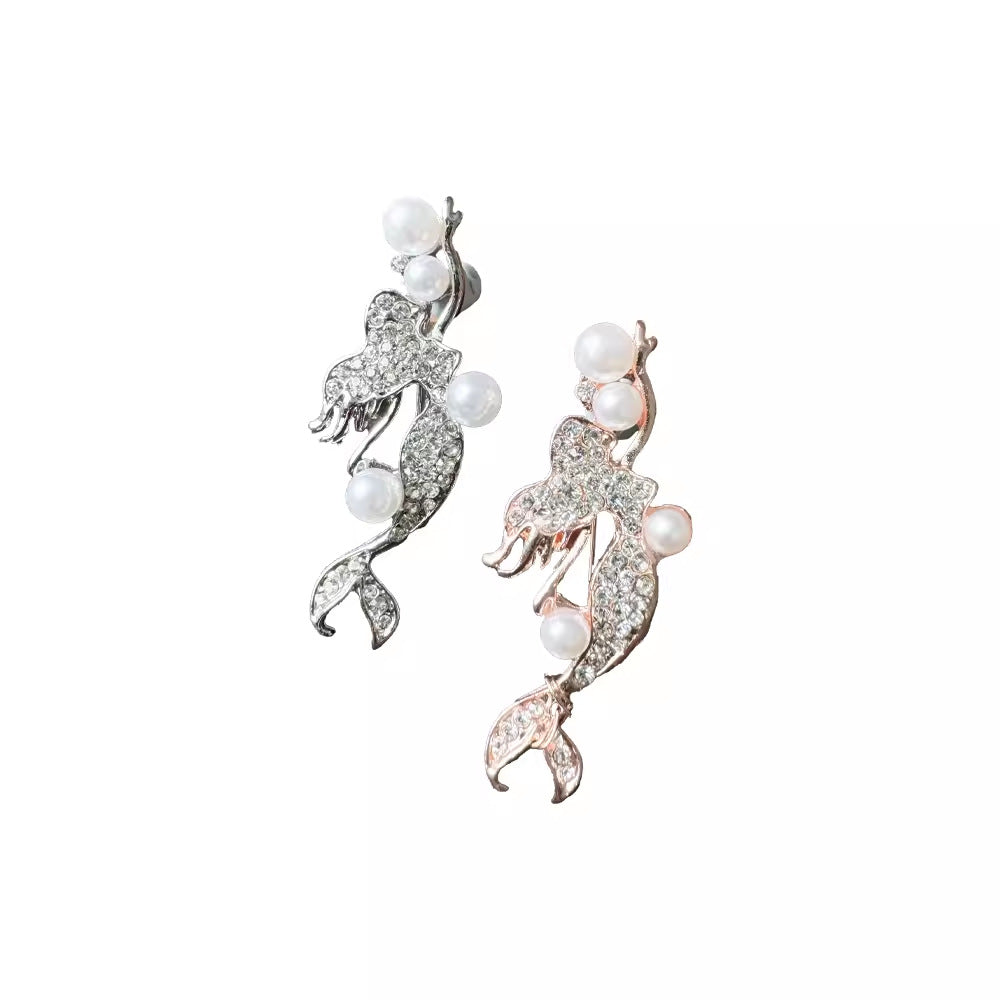 Close-up of crystal adorned mermaid brooch