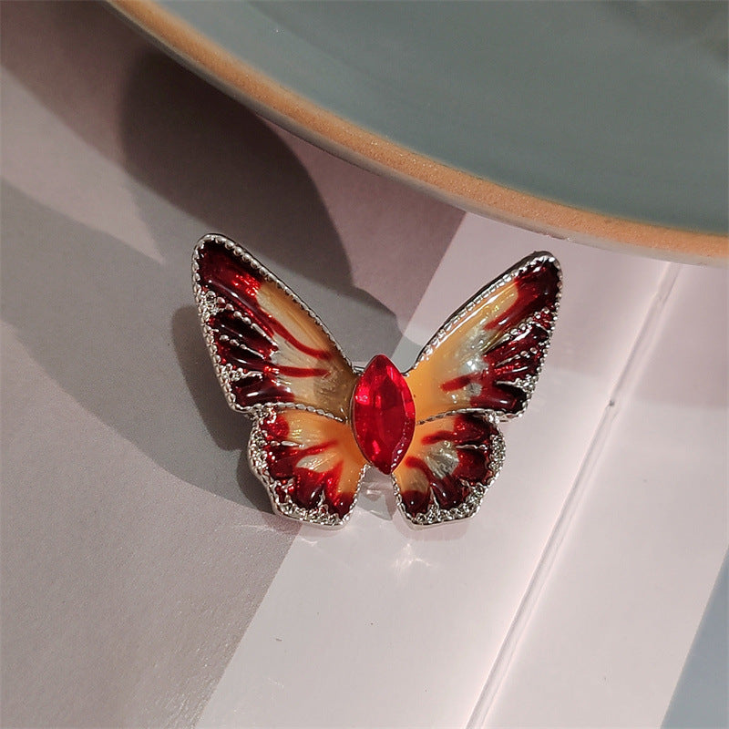 Colorful crystal butterfly brooch on jacket