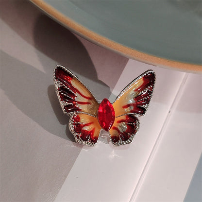 Colorful crystal butterfly brooch on jacket