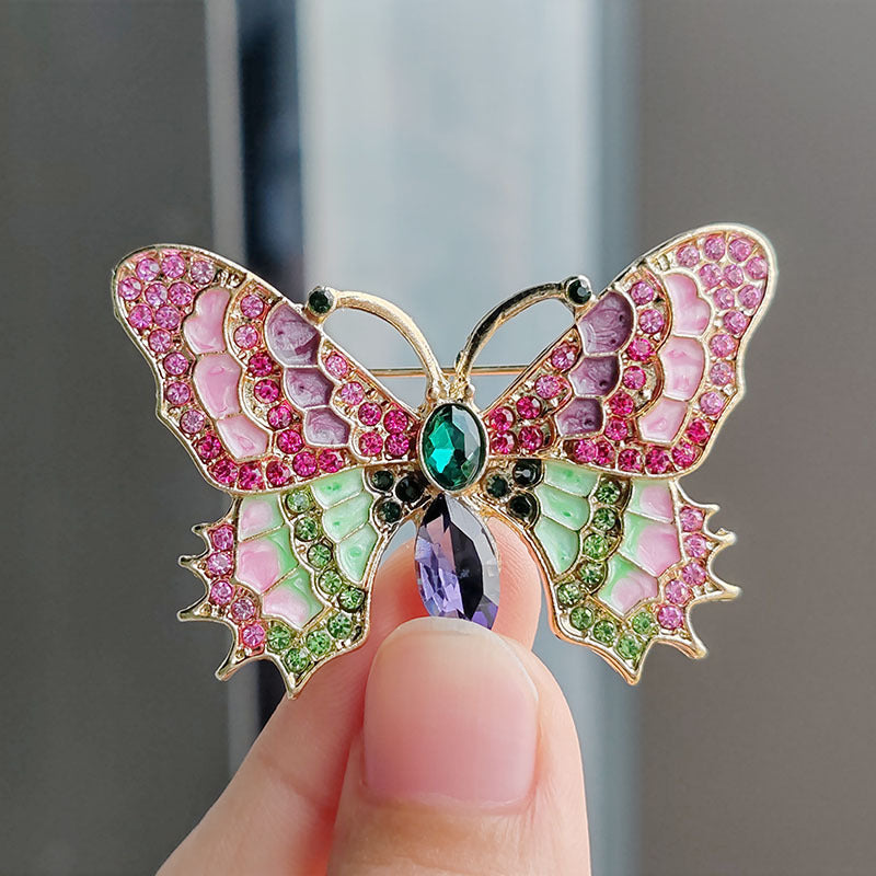 multiple angle views of butterfly brooch