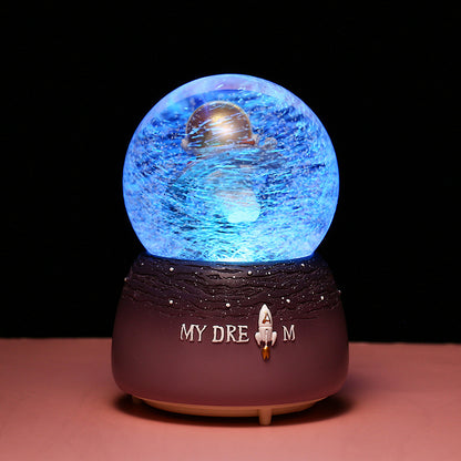 Nightlight snow globe with astronaut and vibrant colors